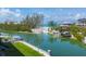 Beautiful waterfront property featuring a private dock, lush greenery, and serene views of the adjacent beach at 9200 Midnight Pass Rd # 30, Sarasota, FL 34242