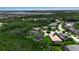 Aerial view showcasing the neighborhood's layout, beautiful homes, green spaces, and proximity to nature, creating a peaceful environment at 932 Mangrove Edge Ct, Bradenton, FL 34208