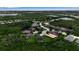Aerial view of a meticulously landscaped community, surrounded by lush greenery and serene lakes, highlighting its prime location at 932 Mangrove Edge Ct, Bradenton, FL 34208