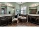 Bright and spacious bathroom featuring double vanity, standalone tub and a large window at 932 Mangrove Edge Ct, Bradenton, FL 34208