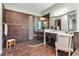 Modern bathroom with a glass shower, a vanity with a granite countertop and a mosaic accent wall at 932 Mangrove Edge Ct, Bradenton, FL 34208