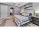 Spacious main bedroom with ensuite bathroom and an arched doorway at 932 Mangrove Edge Ct, Bradenton, FL 34208