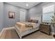 Cozy bedroom with neutral walls, a white bed frame, and shuttered window at 932 Mangrove Edge Ct, Bradenton, FL 34208