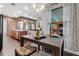 Breakfast nook and view of the modern kitchen with stone accent wall at 932 Mangrove Edge Ct, Bradenton, FL 34208