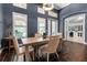 Charming dining room with seating for four, featuring high ceilings and elegant shutters at 932 Mangrove Edge Ct, Bradenton, FL 34208