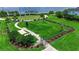 A fully fenced, well-maintained dog park features a water station, bench, and shade at 932 Mangrove Edge Ct, Bradenton, FL 34208