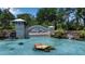 Community entrance featuring a decorative pond, water features, and lush landscaping, highlighting the beautiful Tidewater Reserve at 932 Mangrove Edge Ct, Bradenton, FL 34208