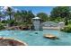 Community entrance featuring a decorative pond, water features, and lush landscaping, highlighting the beautiful Tidewater Reserve at 932 Mangrove Edge Ct, Bradenton, FL 34208