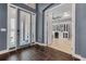 Inviting foyer with dark tile flooring, bright entry, and stylish interior doorway at 932 Mangrove Edge Ct, Bradenton, FL 34208