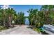 A gravel launch area provides easy access to the water for kayaking and canoeing, surrounded by lush greenery at 932 Mangrove Edge Ct, Bradenton, FL 34208