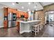 Spacious kitchen with a large island, stone accent wall, stainless steel appliances, and custom cabinets at 932 Mangrove Edge Ct, Bradenton, FL 34208