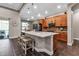Contemporary kitchen featuring an island with seating, modern appliances, and tiled flooring at 932 Mangrove Edge Ct, Bradenton, FL 34208