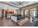 Open living room with stylish furnishings, brick archway, and neutral design at 932 Mangrove Edge Ct, Bradenton, FL 34208