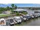 Close up aerial view of boat lifts and boat slips at a community marina in Florida at 932 Mangrove Edge Ct, Bradenton, FL 34208