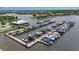 Aerial view of community marina with boat slips and boat house in a Florida neighborhood at 932 Mangrove Edge Ct, Bradenton, FL 34208