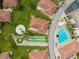 Aerial view of community amenities including shuffleboard court, seating and beautiful landscaping at 110 Vista Hermosa Cir # 302B, Sarasota, FL 34242