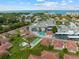 Overhead view showcasing a coastal community with a pool, lush green spaces, and convenient parking at 110 Vista Hermosa Cir # 302B, Sarasota, FL 34242