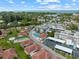 Scenic overhead view of a community featuring meticulously kept landscaping, a pool, and ample parking at 110 Vista Hermosa Cir # 302B, Sarasota, FL 34242