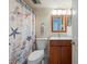 Bathroom featuring a decorative shower curtain, toilet and single sink vanity at 110 Vista Hermosa Cir # 302B, Sarasota, FL 34242