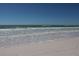 Beautiful ocean view with gentle waves lapping on the sandy shoreline at 110 Vista Hermosa Cir # 302B, Sarasota, FL 34242