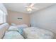 Cozy bedroom showing a ceiling fan and twin bed with matching bedding at 110 Vista Hermosa Cir # 302B, Sarasota, FL 34242