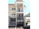 Exterior view of a condo building featuring open-air stairwells with metal railings at 110 Vista Hermosa Cir # 302B, Sarasota, FL 34242