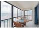 View of lanai with an outdoor dining set and sliding glass doors to the house at 110 Vista Hermosa Cir # 302B, Sarasota, FL 34242