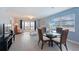 Inviting living room boasts tile floors, a dining table, a sliding glass door, and cozy furnishings at 110 Vista Hermosa Cir # 302B, Sarasota, FL 34242