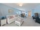 Bright and open living room with dining area and view of the kitchen at 110 Vista Hermosa Cir # 302B, Sarasota, FL 34242