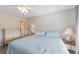 Inviting bedroom with a ceiling fan, neutral walls, matching nightstands, and a queen-sized bed at 110 Vista Hermosa Cir # 302B, Sarasota, FL 34242