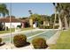 View of shuffleboard courts and surrounding landscaping in the community at 110 Vista Hermosa Cir # 302B, Sarasota, FL 34242