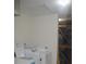 Storage room with washer and dryer hookups and shelving at 110 Vista Hermosa Cir # 302B, Sarasota, FL 34242