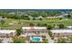 An aerial view showcases the property, surrounded by lush landscaping and a nearby golf course at 1216 Rio De Janeiro Ave # 306, Punta Gorda, FL 33983