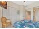 Bright bedroom with tropical-themed decor, built-in wardrobe, and access to the upstairs hallway at 1216 Rio De Janeiro Ave # 306, Punta Gorda, FL 33983