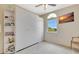 Bedroom offering ample storage with built-in closets, shelving and natural light from a large window at 1216 Rio De Janeiro Ave # 306, Punta Gorda, FL 33983