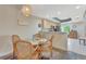 Inviting dining area open to kitchen with hardwood floors and modern decor at 1216 Rio De Janeiro Ave # 306, Punta Gorda, FL 33983