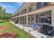 Exterior of condo building showcasing screened patios and lush landscaping at 1216 Rio De Janeiro Ave # 306, Punta Gorda, FL 33983