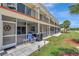 Exterior of the condo with screened patios and walking path access at 1216 Rio De Janeiro Ave # 306, Punta Gorda, FL 33983