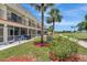 Exterior of the condo building with screened patios and golf course views at 1216 Rio De Janeiro Ave # 306, Punta Gorda, FL 33983