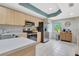 Updated kitchen featuring stainless steel appliances, light wood cabinets, and tile backsplash at 1216 Rio De Janeiro Ave # 306, Punta Gorda, FL 33983