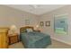 Bedroom with a ceiling fan, window and bedside tables with lamps at 12229 Stuart Dr, Venice, FL 34293