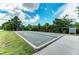 Grand Palm's bocce ball court offers a recreational area for residents amidst lush landscaping and community gathering spaces at 12229 Stuart Dr, Venice, FL 34293