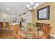 Cozy breakfast nook features bright natural light, glass table and wicker chairs at 12229 Stuart Dr, Venice, FL 34293