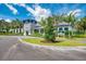 Charming community clubhouse with stone accents, blue trim, and manicured landscaping enhances curb appeal at 12229 Stuart Dr, Venice, FL 34293