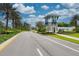 Grand Palm entrance featuring attractive architecture, lush landscaping, and a welcoming atmosphere at 12229 Stuart Dr, Venice, FL 34293