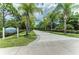 Explore Exploration Park, with paved walkways, lush palms, and plenty of shade at 12229 Stuart Dr, Venice, FL 34293