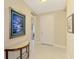Bright foyer showcasing tiled flooring, artwork, and an inviting entrance to the home at 12229 Stuart Dr, Venice, FL 34293