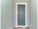 Classic front door providing a welcoming entrance with neutral wall color and beach-themed welcome mat at 12229 Stuart Dr, Venice, FL 34293