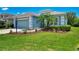 Charming home featuring a well-manicured lawn and lush landscaping, enhancing its curb appeal at 12229 Stuart Dr, Venice, FL 34293