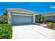 A well kept home featuring a large garage and wide driveway offering ample parking at 12229 Stuart Dr, Venice, FL 34293